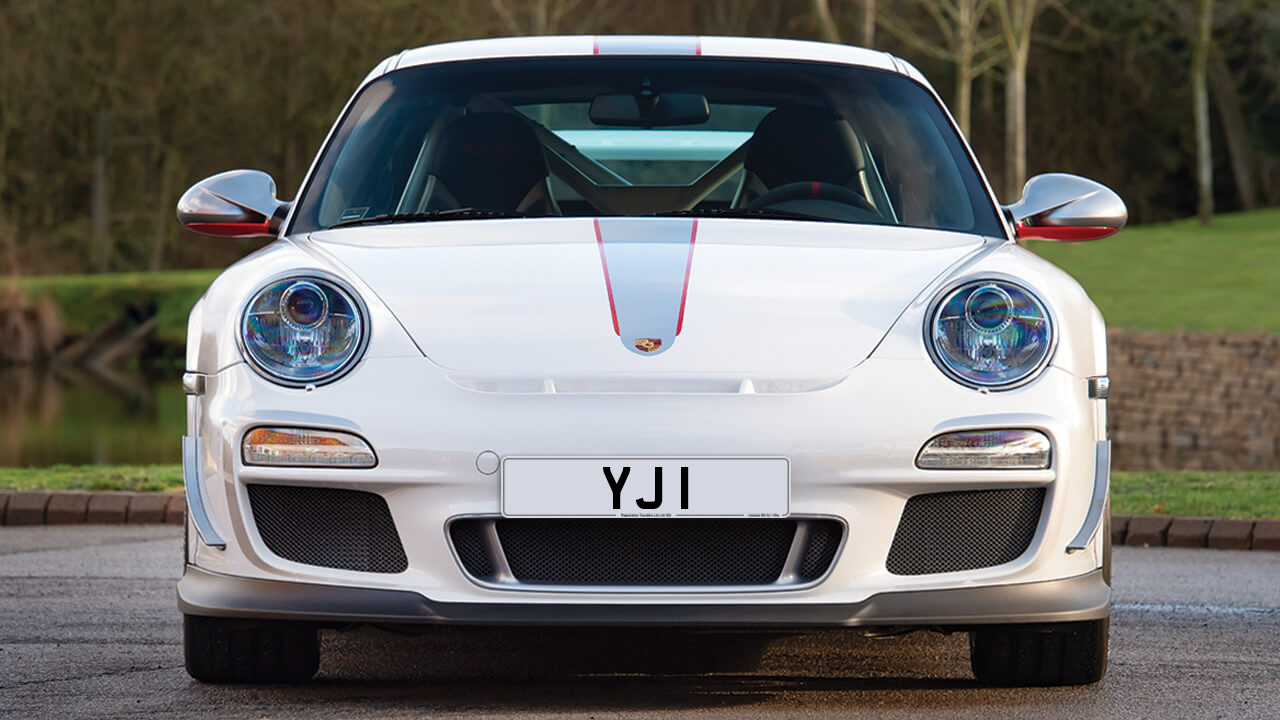 Car displaying the registration mark YJ 1